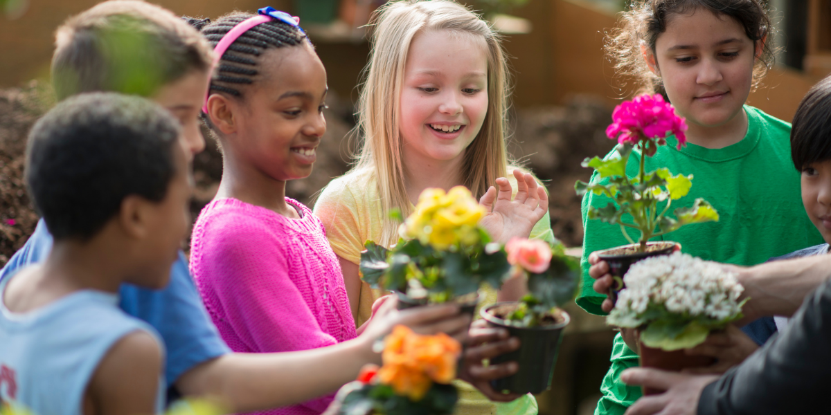 Picture of small children holding flower pots